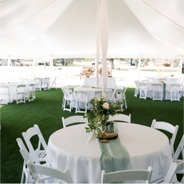 White tent with round tables shows what to look for in a wedding venue